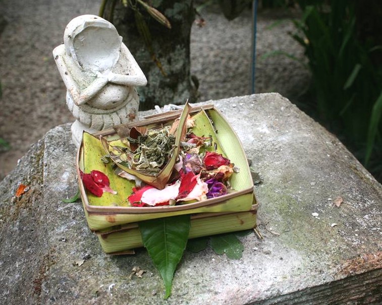 Statue with offerings